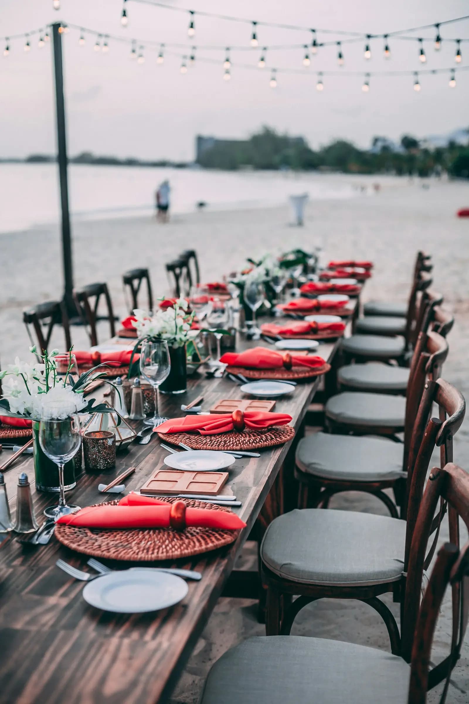 Long dinner table set on the beach